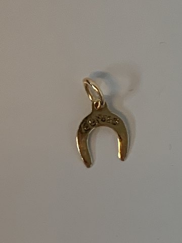 Horse shoe in 14 karat gold
Stamped EGI 585
Height 15.65 mm