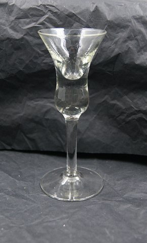 Bell glasses (Klokkeglas) by Holmegaard glasworks, Denmark.
Schnapps glasses, clear 14.5cm & 14.8cm