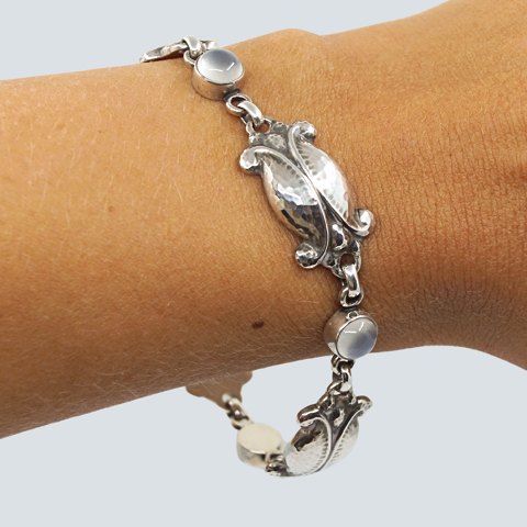 Georg Jensen; A "Moonlight Blossom" bracelet of sterling silver, set with 
moonstone, No. 11