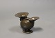 Speciel vase i disko metal, designet af Just Andersen i midten af 1930erne.
5000m2 udstilling.
