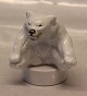 Royal Copenhagen Art Pottery 22746 RC Polar bear cub sitting with paw to paw on 
round base 10 x 9 cm  (# 1049246) 10 cm, Jeanne Grut,  May 1982 (0346)