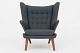 Hans J. Wegner / AP Stolen
AP 19 - Reupholstered Papa Bear chair in Clara 2 wool (code: 987) w. buttons in 
Savanne leather (color: Coffee). Paws in teak and legs in oak.
Availability: 6-8 weeks
Renovated

