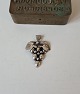 Vintage silver pendant in the shape of a bunch of grapes.