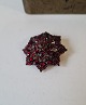 Antique star-shaped garnet brooch