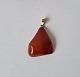 Amber pendant with  8 kt gold