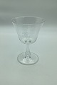 Wine glass with monogram on bell-shaped basin and hollow stem