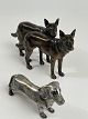 Hunde-figurer af metal. Vintage fra det 20. århundrede. Gravhund i "hvidt" 
metal, schæferhunde i mørkt.