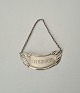 Bottle label in silver with the text "Sherry"