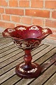 Bohemian glass.
Ruby red centerpiece or candy bowl on high stand with nice decoration