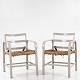 Magnus Stephensen / Snedkermester Clausen
Pair of easy chairs in grey painted wood with patinated seat of paper yarn and 
back with tilt function. Ca. 1933.
1 pc. in stock
Good, used condition
