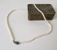 Freshwater pearl with antique sapphire and diamond in gold & silver
