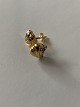 Stud earrings in 14 carat red and white gold with inlaid brilliant.