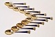 Set of 11 coffee spoons in gold-plated sterling silver and blue enamel decorated 
with a royal crown