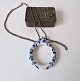 Royal Copenhagen magnifying glass in porcelain frame decorated with blue flowers 
on a long chain