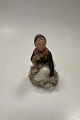Royal Copenhagen Overglaze figurine of Amager Flower Girl No. 12412