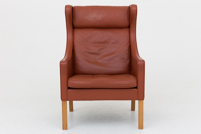 Børge Mogensen / Fredericia Furniture
BM 2204 - Wing chair in brown leather and legs in oak. See matching foot stool 
w. ref. no. 1037916
1 pc. in stock
Good, used condition
Location: Roxy Klassik Shop - Godthåbsvej 20, 2000 FRB.
