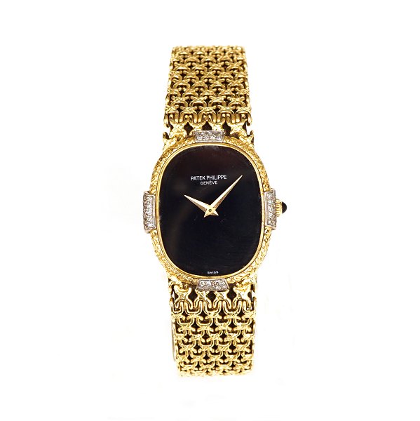 Patek Philippe Golden Ellipse mit Zifferblatt aus Onyx. Armband und Gehäuse aus 
18kt Gold mit Diamanten. Ref. 4307. Zifferblatt: 2,5x2,1cm. Länge Armband: 
18,5cm