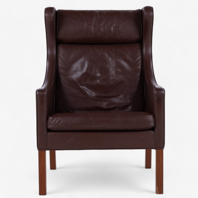 Børge Mogensen / Fredericia Furniture.
BM 2204 - Armchair in patinated, original dark brown leather with mahogany 
legs.
1 pc. in stock
