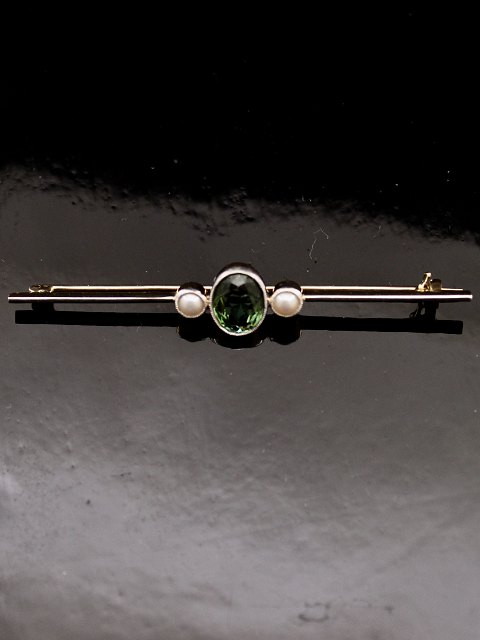 14 karat guld stav broche med turmalin